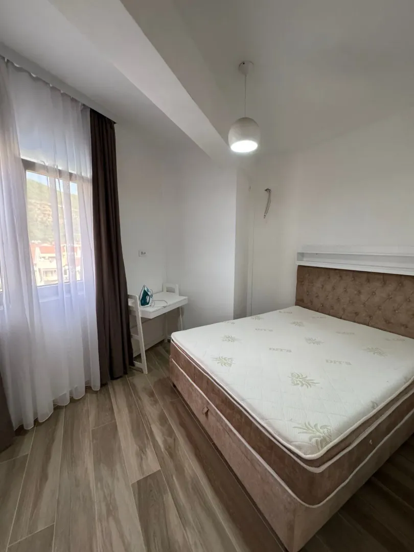 Bedroom with a double bed and a window.