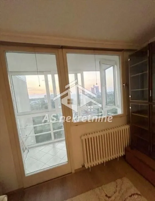 View from the living room towards the enclosed terrace and outdoor area.