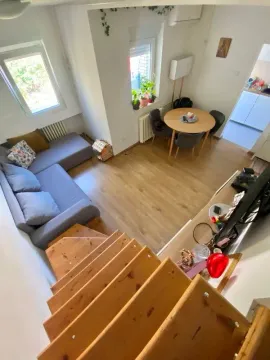 Top-down view of the living room with a sofa and dining area. - image 8