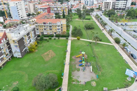 View from the terrace overlooking a landscaped park, green areas, and the urban surroundings. - image 16