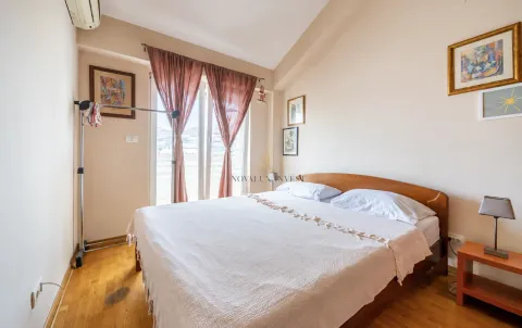 Bedroom with a double bed, wooden flooring, and access to the terrace. - image 5