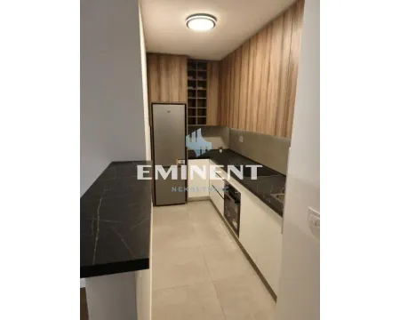 Modern kitchen with wooden elements and built-in appliances. - image 15