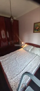 Furnished bedroom with a double bed and a wardrobe. - image 3