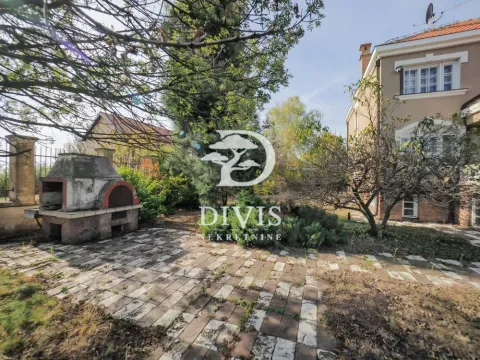 View of the house yard with a barbecue and paved area. - image 17