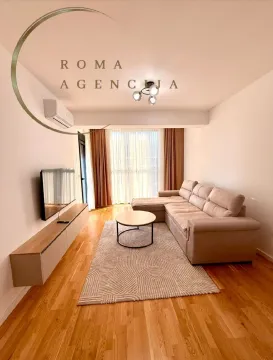 Bright living room with sofa and TV unit. - image 4