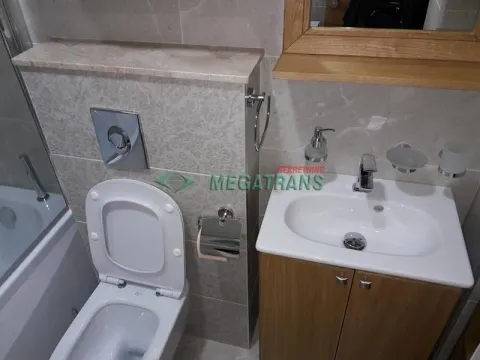 View of the bathroom with a sink, toilet, and bathtub. - image 20