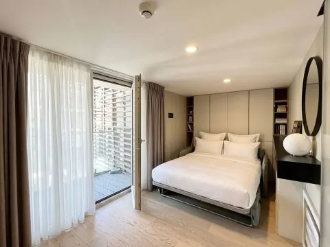 Modern bedroom with a double bed and access to the terrace. - image 5