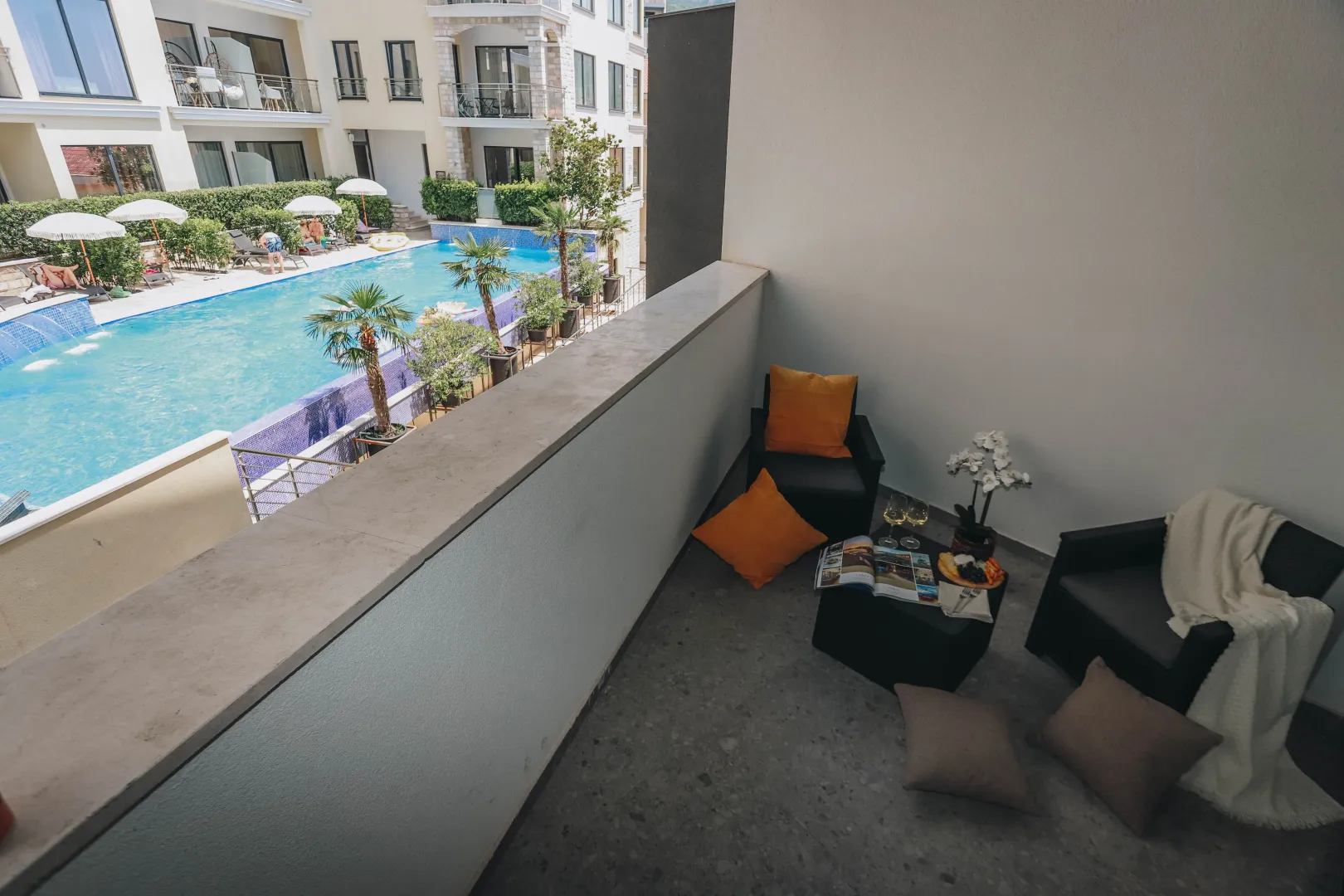 Furnished terrace with seating area and a view of the swimming pool.