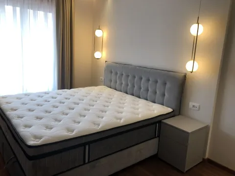 Bright bedroom with a modern bed and lighting. - image 19