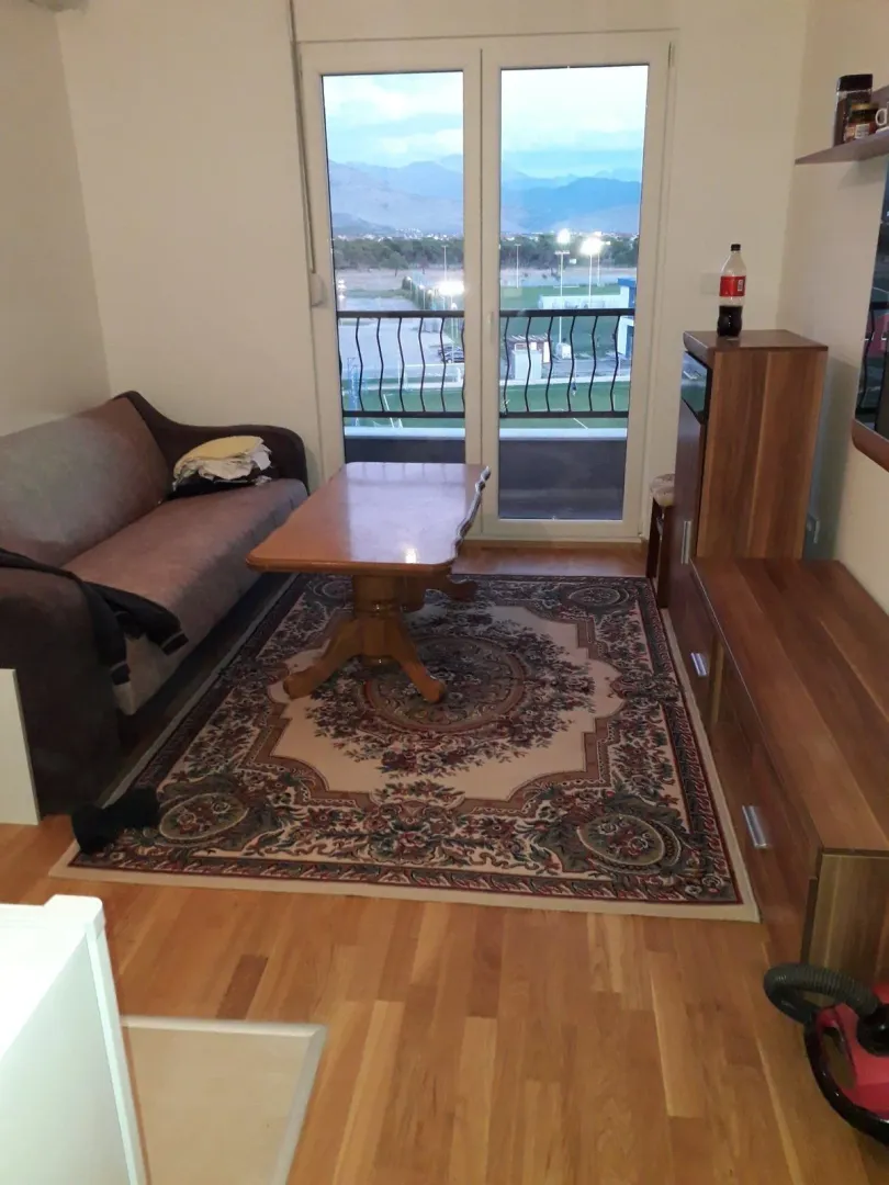 Simple living room with a sofa and table.