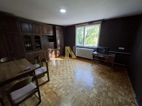 Spacious living room with wooden furniture and parquet flooring. - image 2