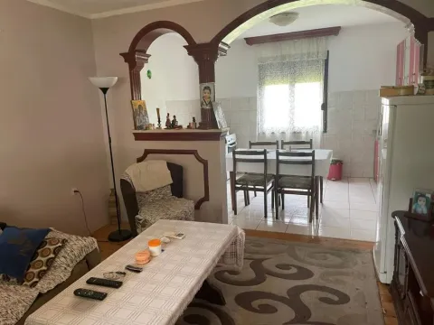 Living room with a view of the dining area and kitchen in the background. - image 8