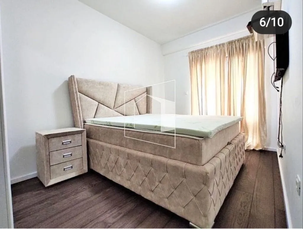 Bedroom with a double bed and a nightstand.