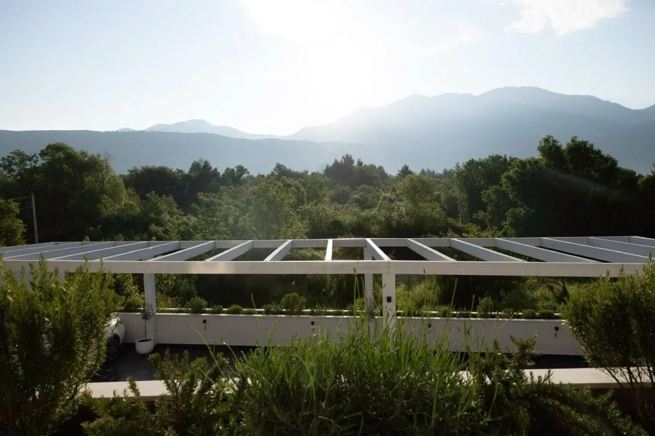 Terrace with a pergola and mountain view.