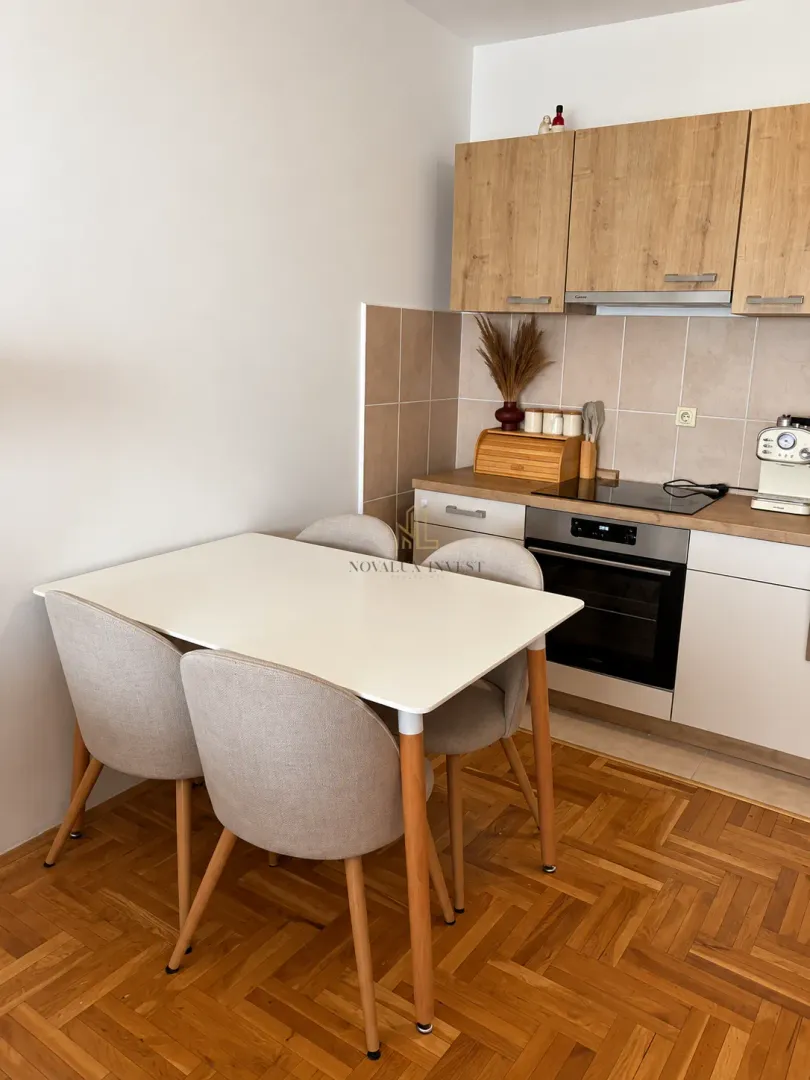 Kitchen with a dining table and chairs.