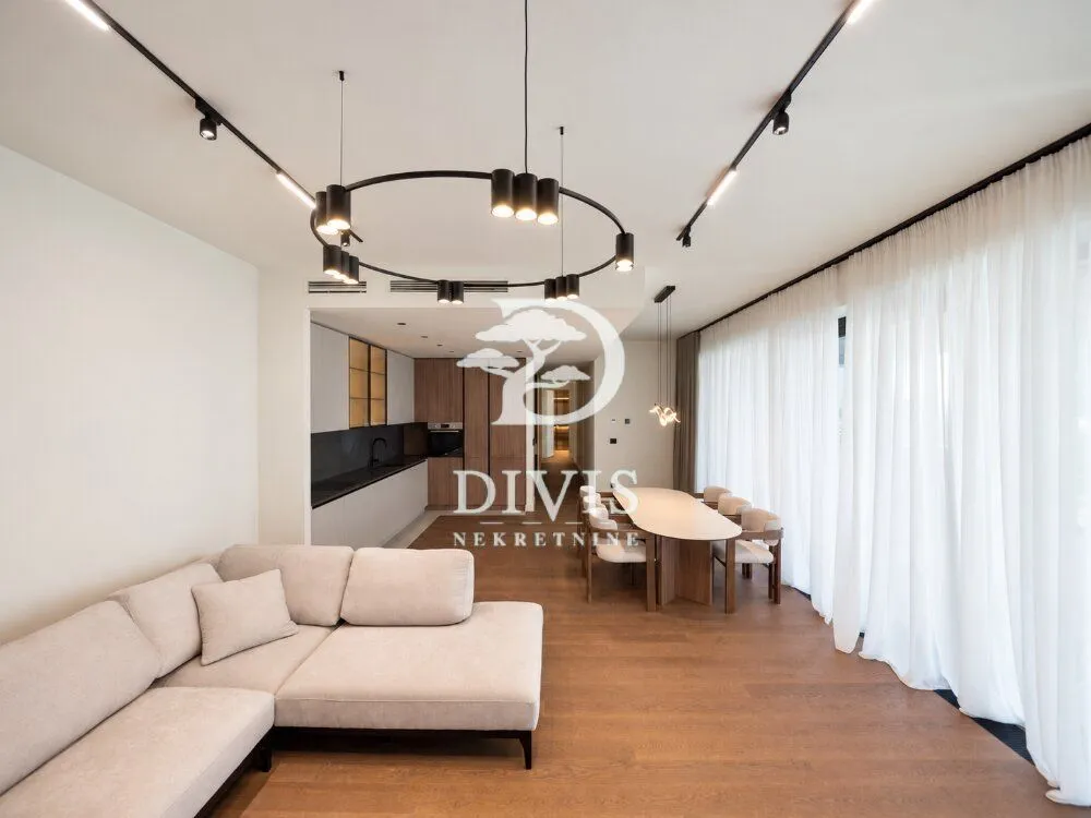 Spacious living room connected with the dining area and kitchen.