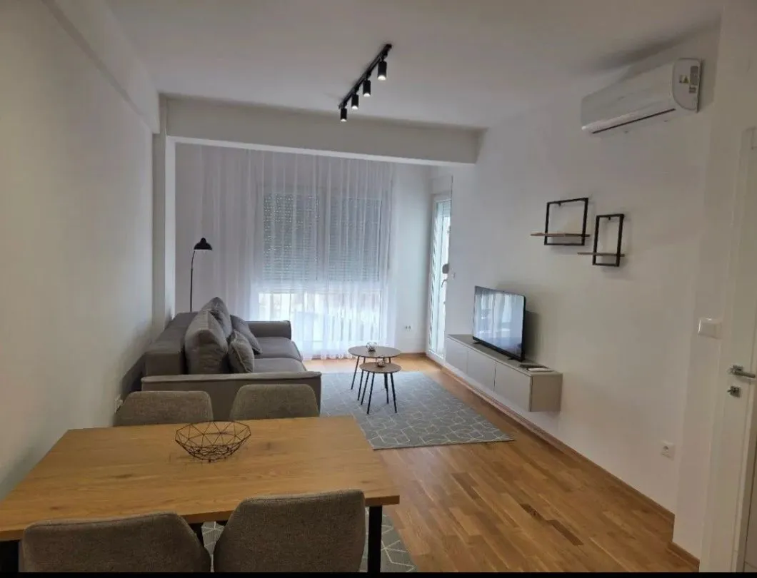 Living room with dining area and sofa.