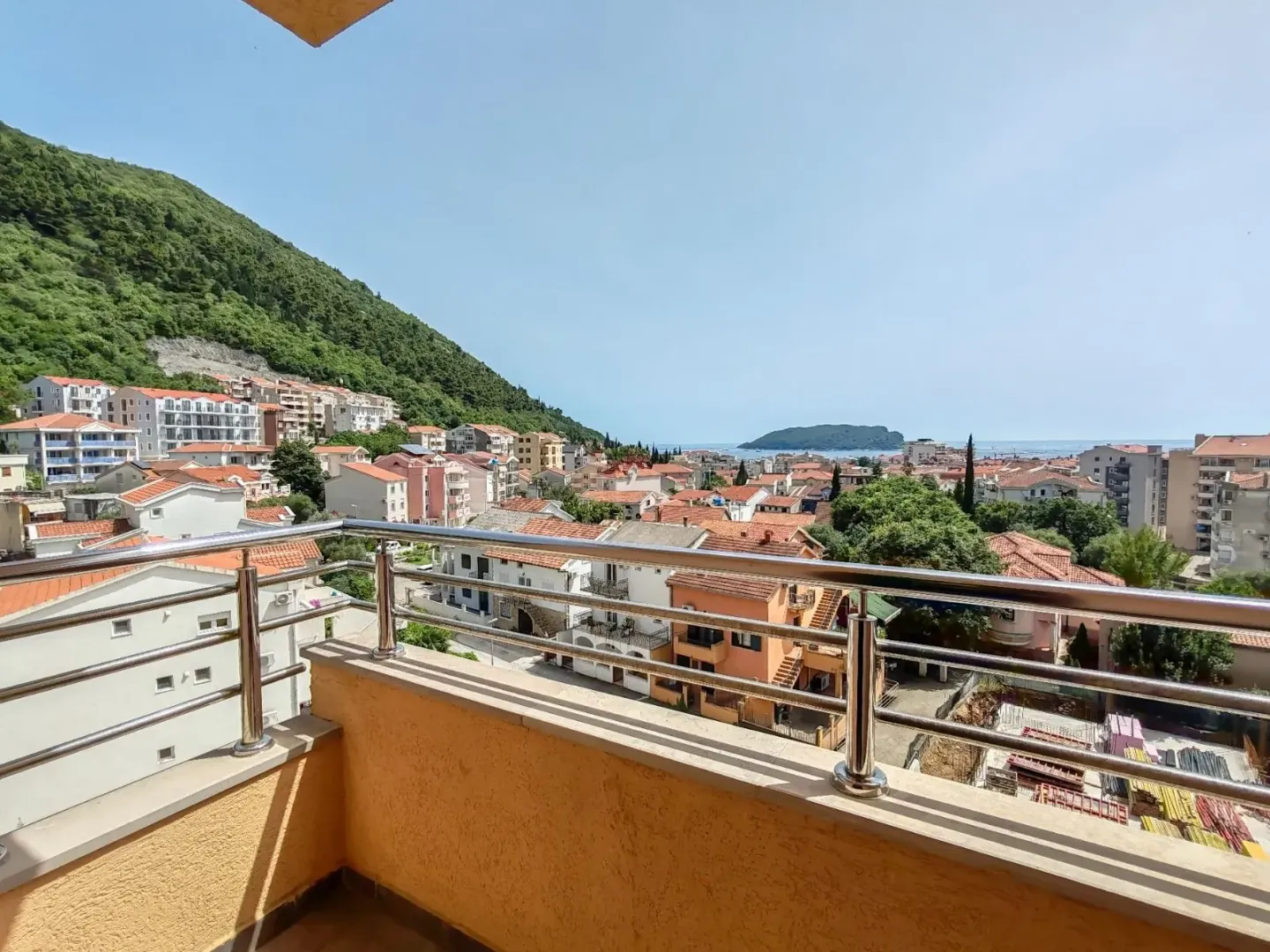 View from the balcony overlooking the town, hill and sea.