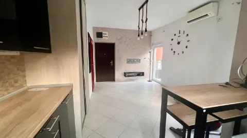 View of the living room with dining area and part of the kitchen. - image 2