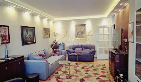 Living room with sofa set, small tables and television. - image 2