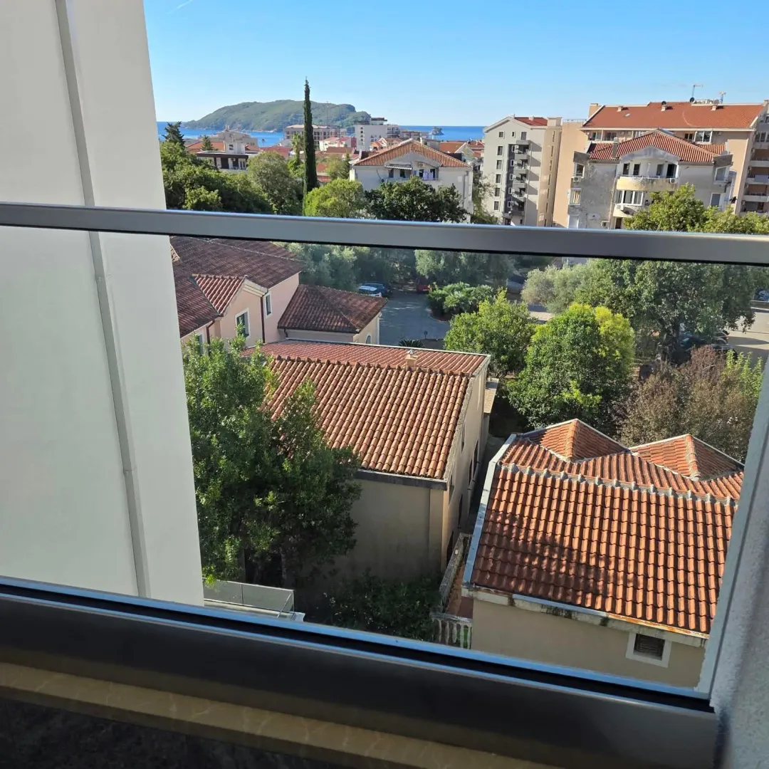 View from the terrace towards the neighborhood and the sea in the distance.