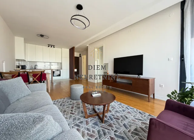 Spacious living room connected to the dining area and kitchen.
