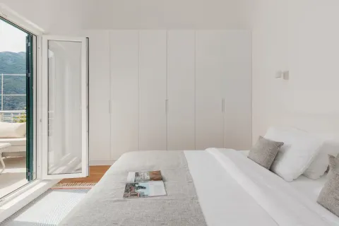 Bright bedroom with a large wardrobe and access to the terrace. - image 10