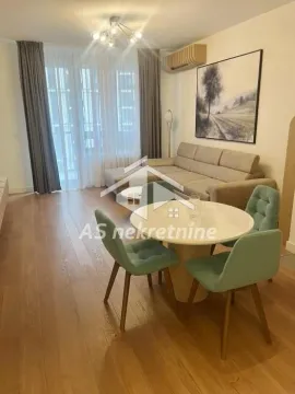 Living room with a dining area and seating set. - image 21