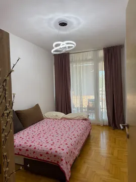 Furnished bedroom with a double bed and access to the terrace. - image 8