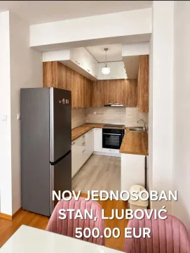 Moderna kuhinja sa drvenim elementima i ugradnim uređajima. - image 2