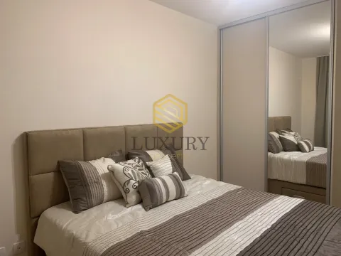 Furnished bedroom with a double bed and a built-in mirrored wardrobe. - image 5