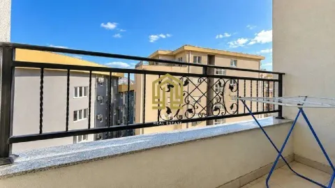View from the terrace facing surrounding buildings and blue sky. - image 2