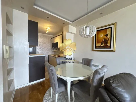 Living room with dining area and kitchen in the background. - image 3