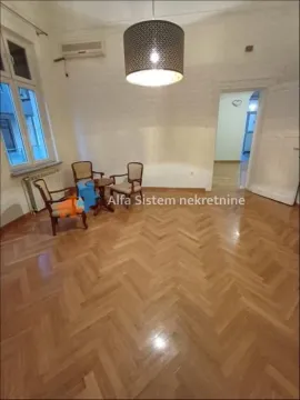 Living room with parquet flooring, seating set and a pendant light fixture. - image 11