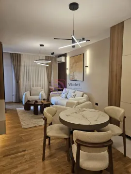 Modern living room with a sofa set, armchairs, and a dining table. - image 17