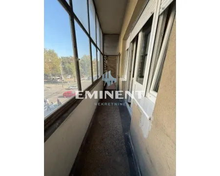 Enclosed balcony with street view. - image 14