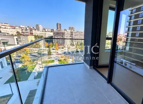 Modern balcony with glass railing and city view. - image 9