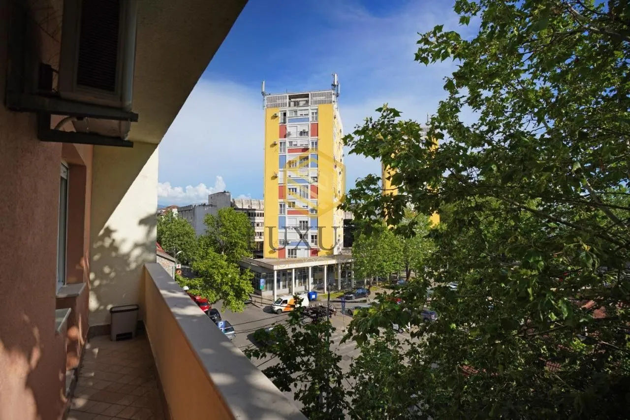 View from the terrace of surrounding buildings and trees.