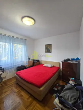 Furnished bedroom with a double bed, window and dresser. - image 3