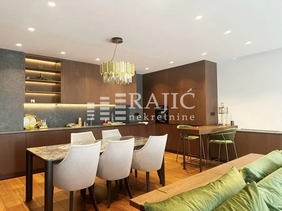 Modern and bright living room with dining area and kitchen.