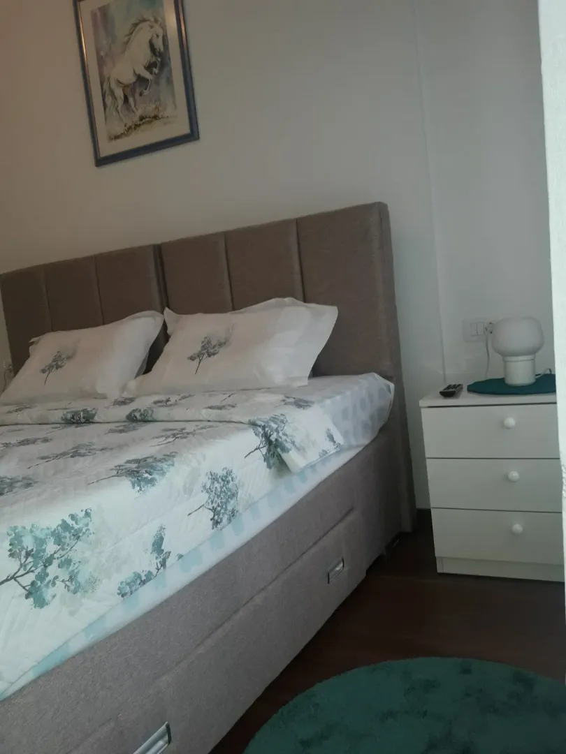 Tidy bedroom with a double bed.