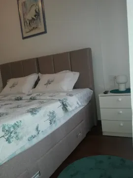 Tidy bedroom with a double bed. - image 8