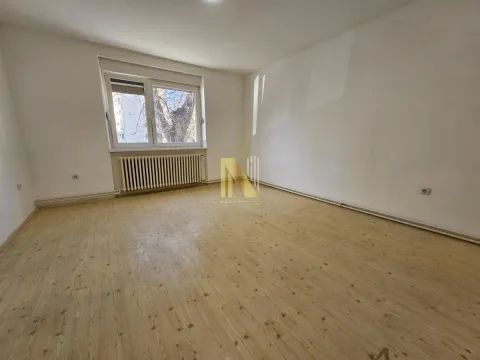 Empty room with wooden flooring and a window. - image 5