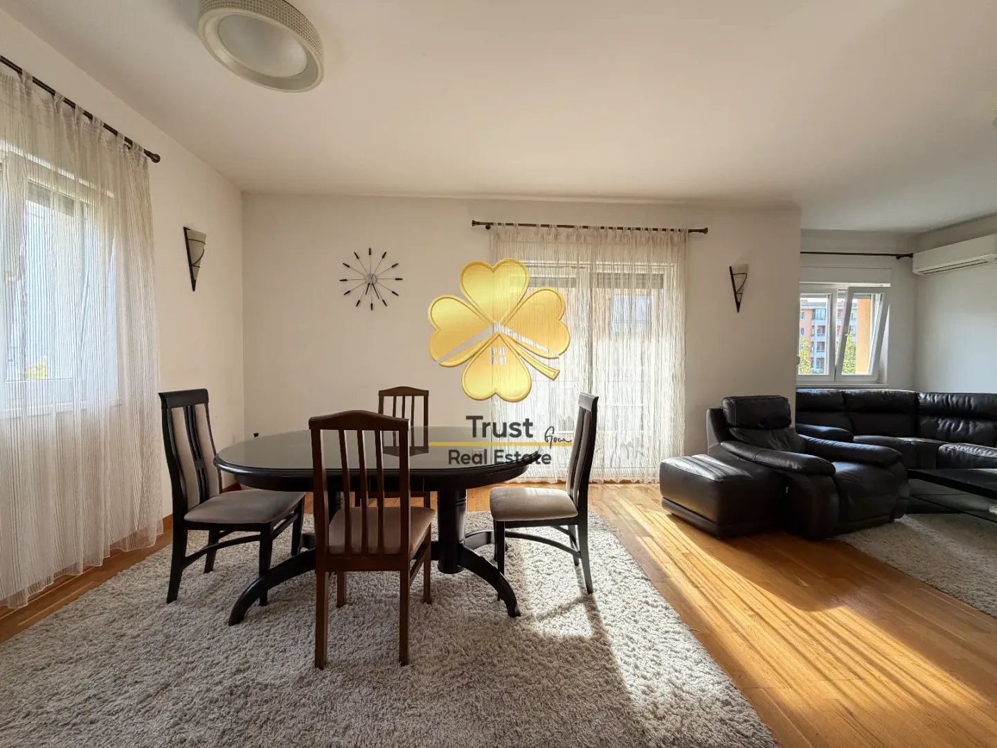 Spacious living room with a dining area and sofa set.
