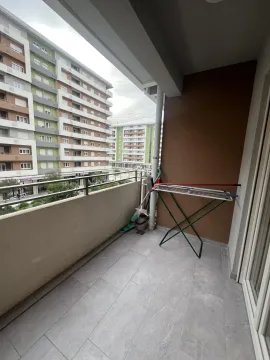 Terrace overlooking neighboring buildings. - image 7