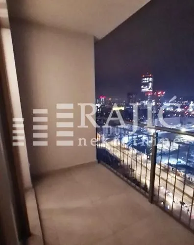 Unfurnished balcony with a night city view.