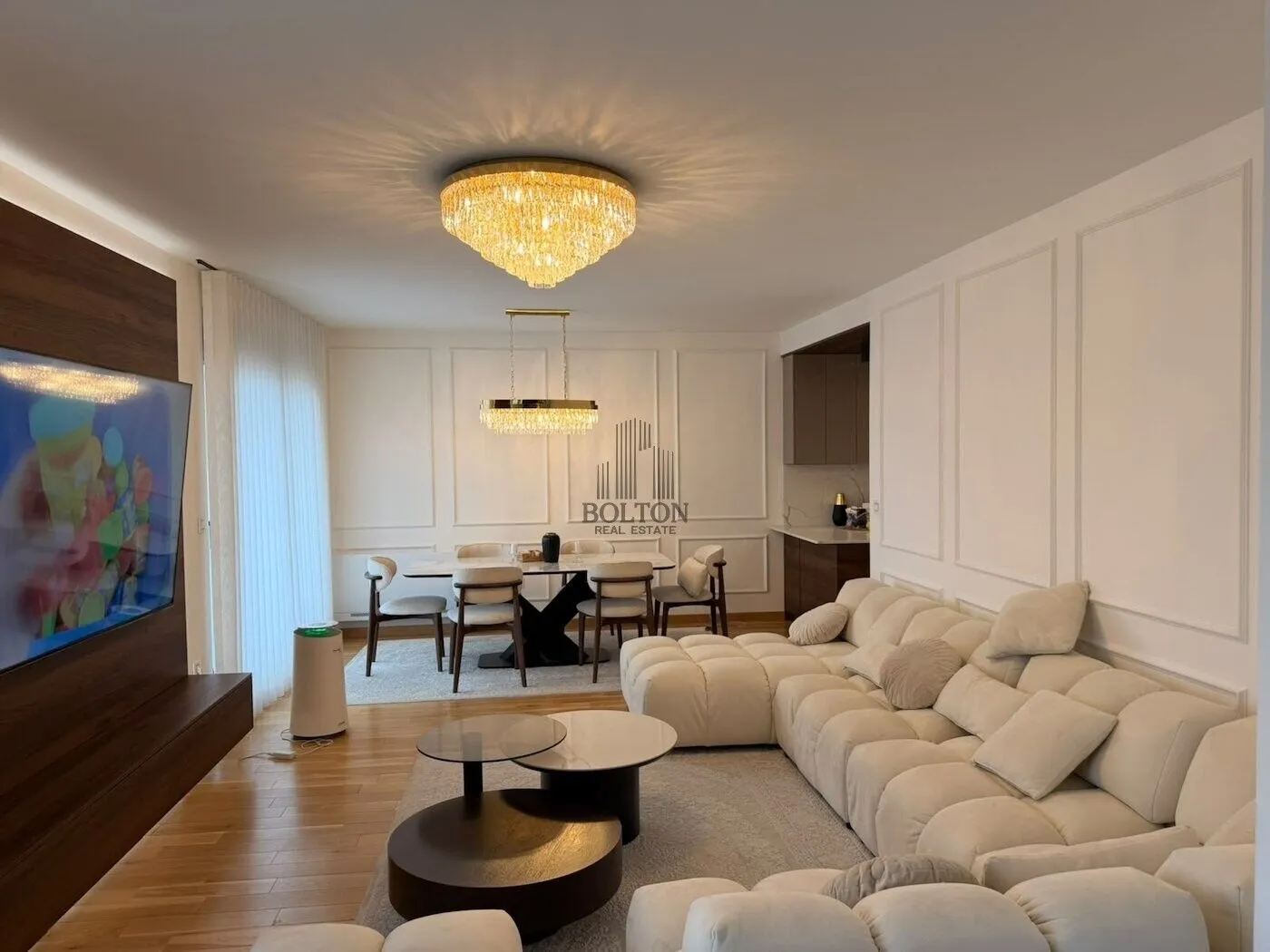Spacious living room with dining area and modern furniture.