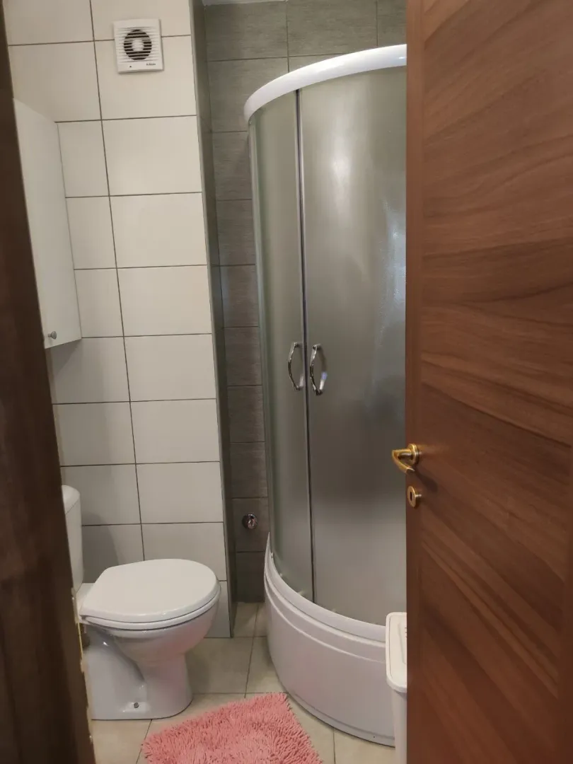 Small bathroom with a shower cabin.