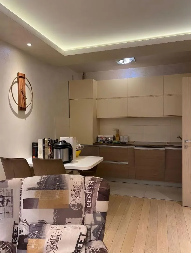 Kitchen with a dining area and part of the living room.