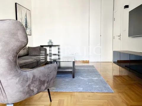 Modern and bright living room with a sofa and parquet flooring. - image 3